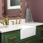 Bold New Orleans inspired colors adorn this remodeled bathroom