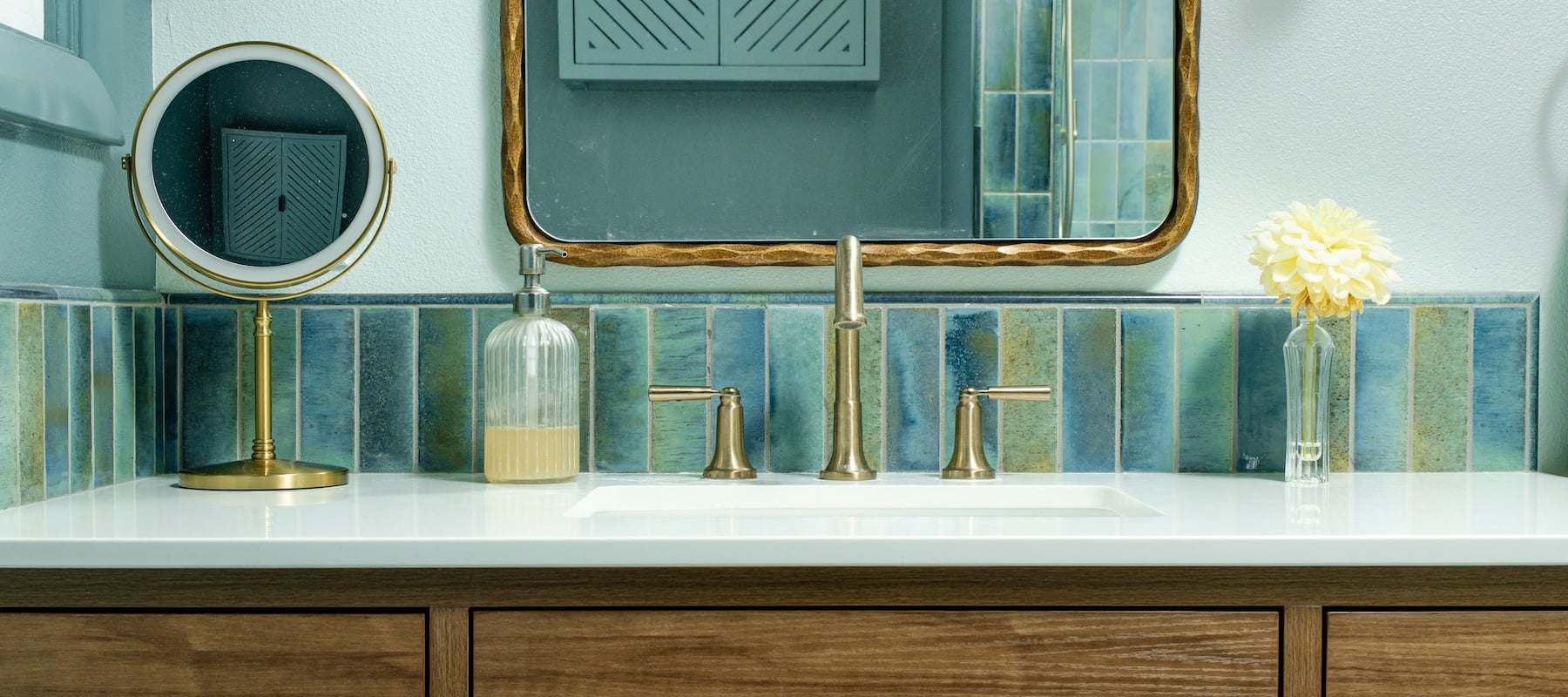 Gorgeous bathroom remodel with custom color scheme, vanity, countertop, and lighting